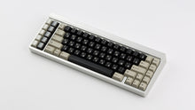 Load image into Gallery viewer, DMK Rubber on silver keyboard
