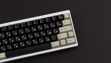 Load image into Gallery viewer, DMK Rubber on white keyboard zoomed right side angled