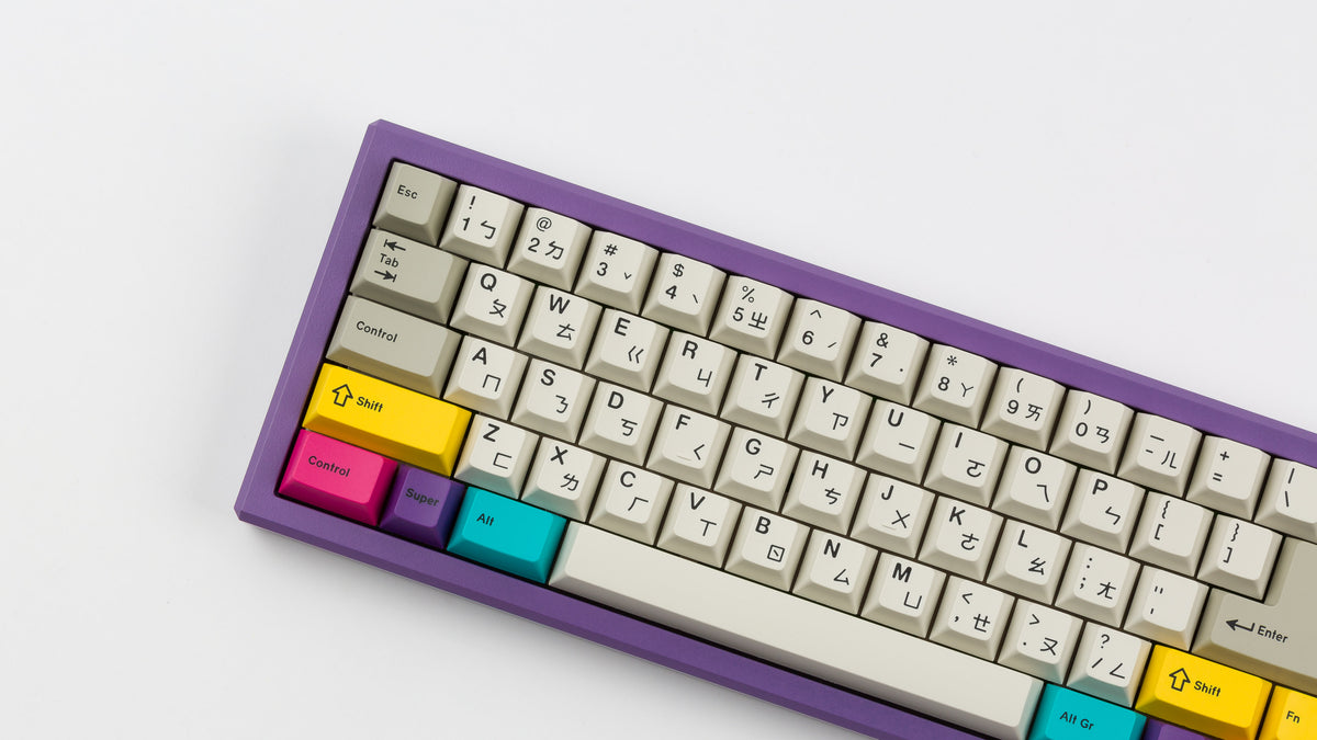  GMK CYL Beige Addon on a purple keyboard zoomed in on left 