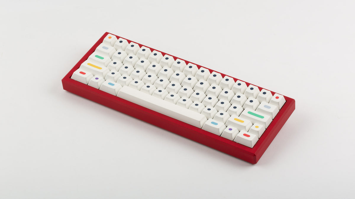  GMK CYL Dots light base on a red keyboard angled back 