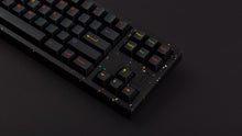 Load image into Gallery viewer, GMK CYL Nachtarbeit on a colorful confetti style back keyboard zoomed in on right