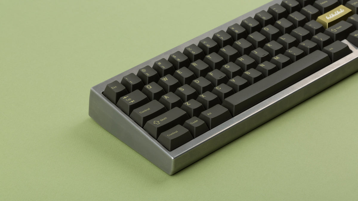  GMK CYL Olive R2 on a silver keyboard zoomed in on left 