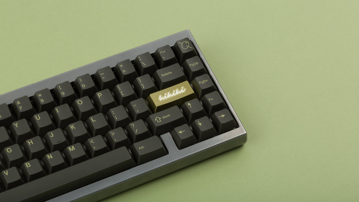  GMK CYL Olive R2 on a silver keyboard zoomed in on right focused on hibi enter artisan keycap 