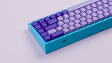 Load image into Gallery viewer, GMK CYL Vaporwave hiragana on a blue NK65 zoomed in on left back side