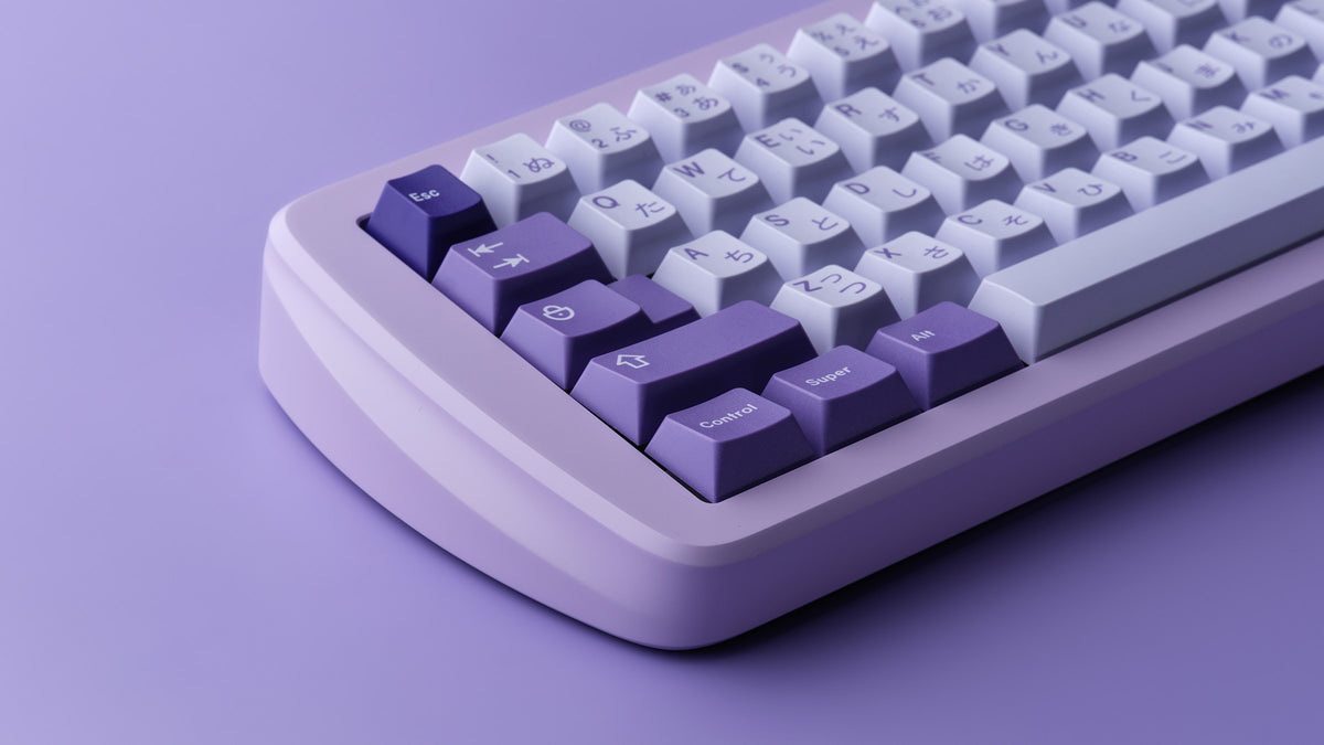 left side of lavender case featuring some keycaps