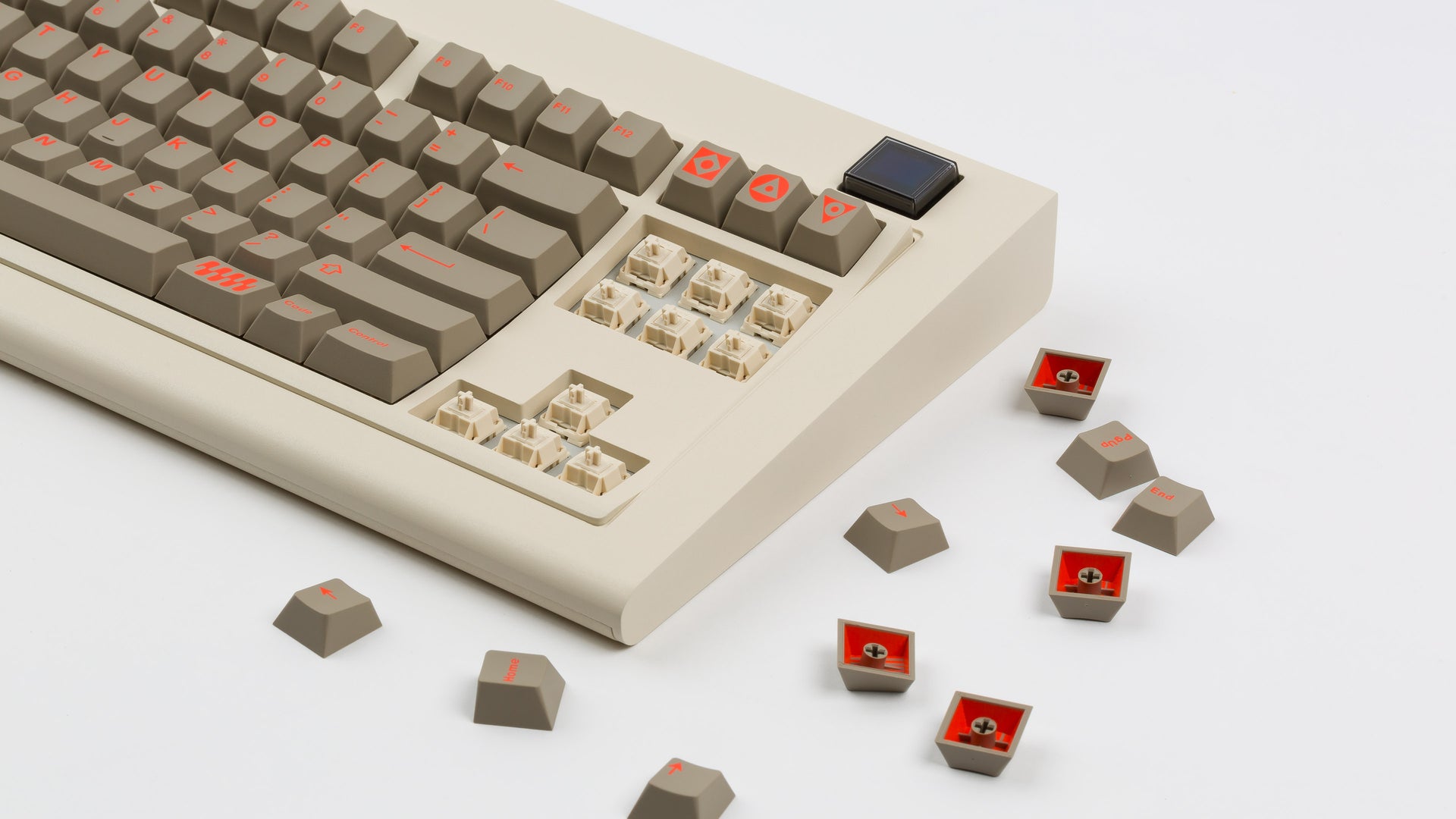 Vintage Beige Model OLED zoomed in on right featuring Key Kobo Signet with cream switches