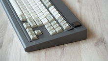 Load image into Gallery viewer, Industrial grey Model OLED zoomed in on right featuring MTNU Beige keycaps