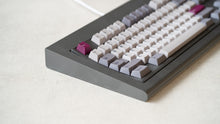 Load image into Gallery viewer, Industrial grey Model OLED zoomed in on left featuring white light purple, and magenta keycaps