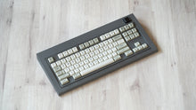 Load image into Gallery viewer, Industrial grey Model OLED at an angle featuring MTNU Beige keycaps
