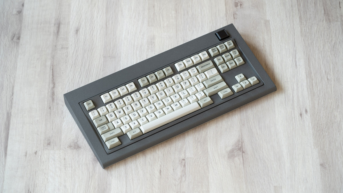 Industrial grey Model OLED at an angle featuring MTNU Beige keycaps 