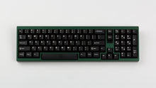 Load image into Gallery viewer, green case featuring white on black keycaps