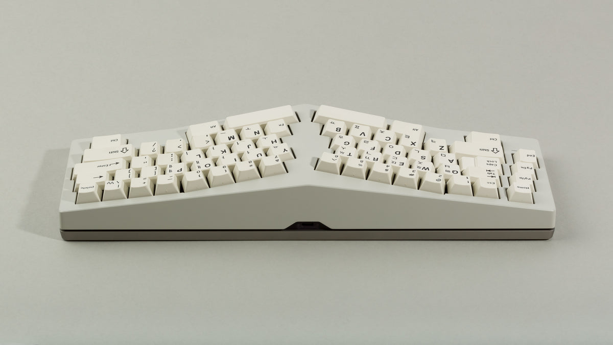 Powder coat beige Type-K back view with sandblasted stainless steel weight featuring black on beige keycaps