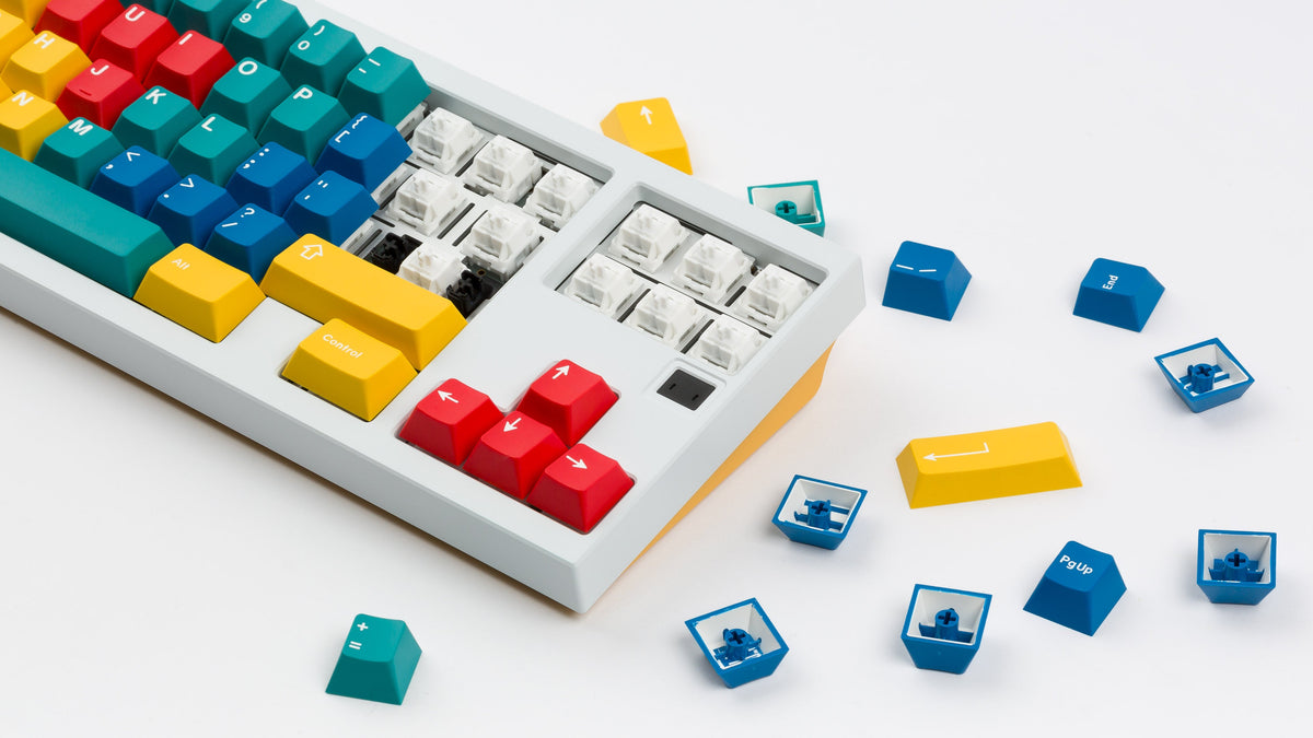  White XOX 70 FRL TKL with yellow bottom featuring handarbeit keycaps angled  
