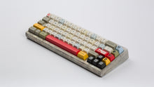 Load image into Gallery viewer, X Wing keycaps on an unfinished Aluminum keyboard angled