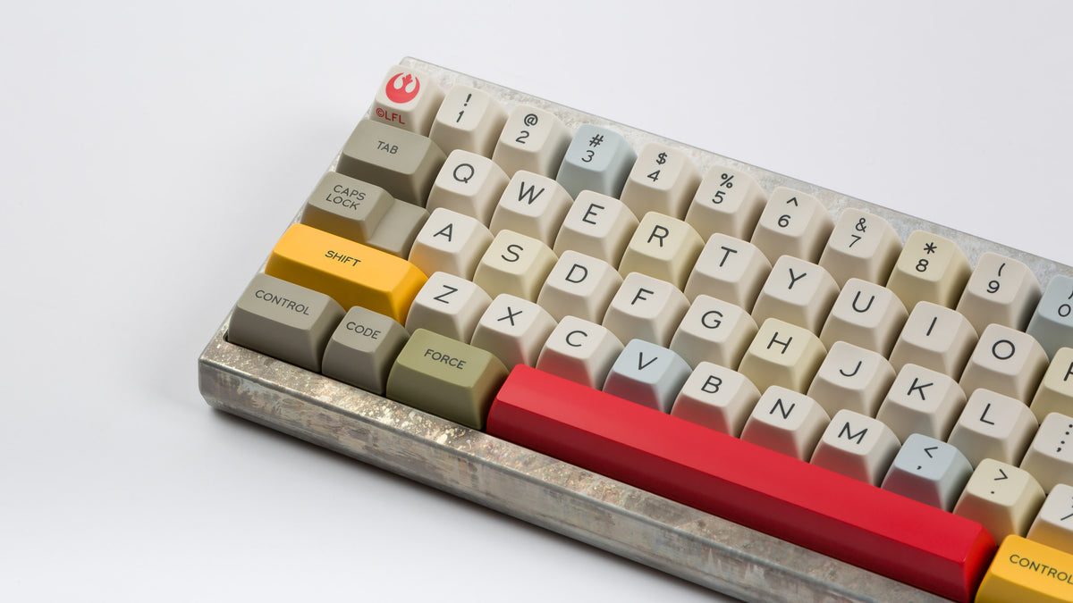  X Wing keycaps on an unfinished Aluminum keyboard zoomed in on left 
