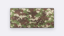 Load image into Gallery viewer, Camo Deskpad in Forest with a green, brown, and cream digital camouflage pattern on a white background