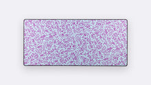Load image into Gallery viewer, Art Movement Deskpad in Memphis with pale aqua, magenta, and purple hand-drawn geometric doodles on a white background