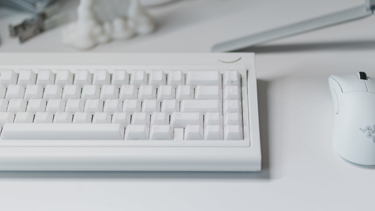  curve 65 keyboard in white on desk front view close up 