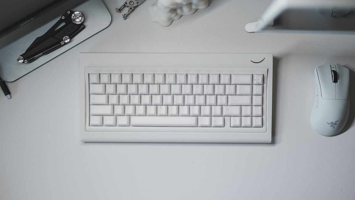  curve 65 keyboard in white on desk top down 