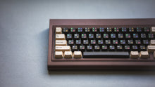 Load image into Gallery viewer, curve 65 keyboard in brown close up on left side
