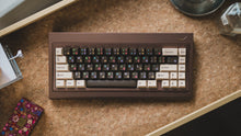 Load image into Gallery viewer, curve 65 keyboard in brown on cork top down