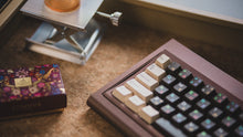 Load image into Gallery viewer, curve 65 keyboard in red on brown close up on left side