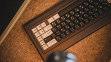 Load image into Gallery viewer, curve 65 keyboard in brown on cork top down close up of right side upside down