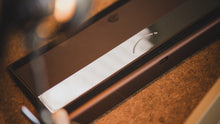 Load image into Gallery viewer, curve 65 keyboard in brown on cork bottom view close up on left side angled