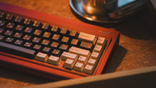 Load image into Gallery viewer, curve 65 keyboard in red on cork close up on right side