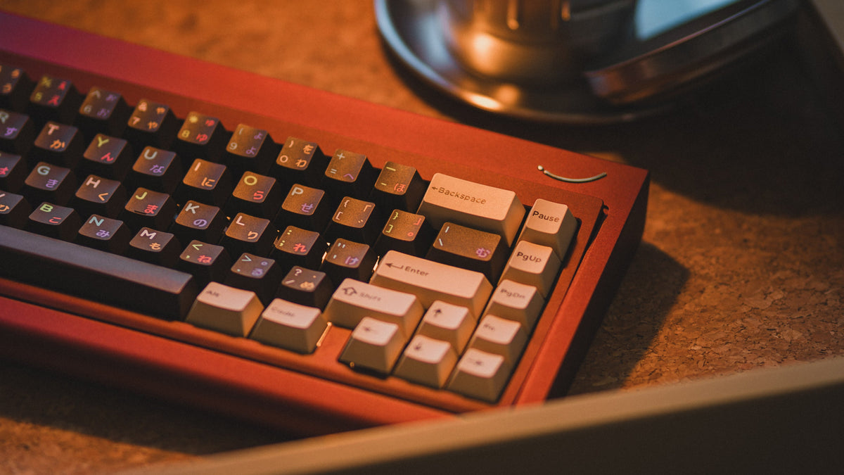  curve 65 keyboard in red on cork close up on right side 