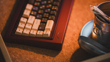 Load image into Gallery viewer, curve 65 keyboard in red on cork close up on right side vertical