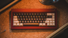 Load image into Gallery viewer, curve 65 keyboard in red on cork top down