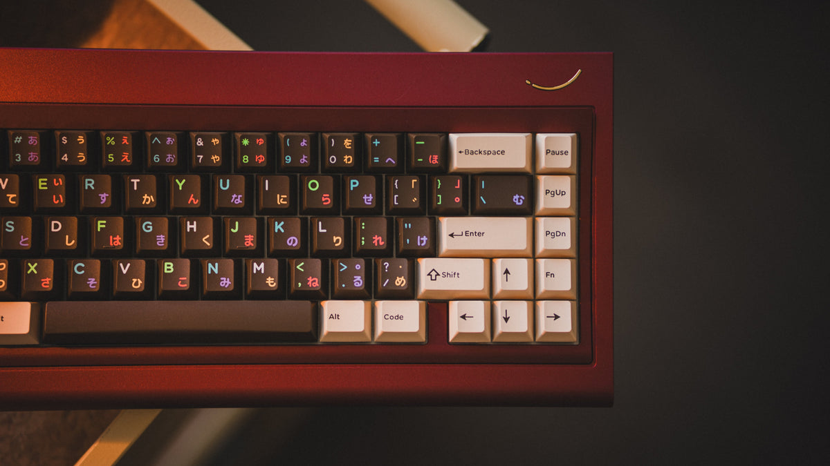  curve 65 keyboard in red on cork top down hanging of shelf close up on right side 