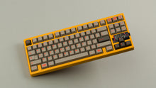 Load image into Gallery viewer, Sunflower yellow MATRIX 8XV 3 ⅓ angled featuring grayish brown keycaps with red lettering