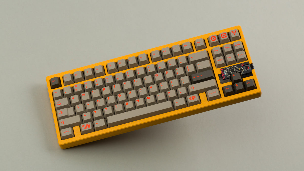 Sunflower yellow MATRIX 8XV 3 ⅓ angled featuring grayish brown keycaps with red lettering