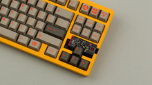 Load image into Gallery viewer, Sunflower yellow MATRIX 8XV 3 ⅓ zoomed in on the right side angled featuring grayish brown keycaps with red lettering