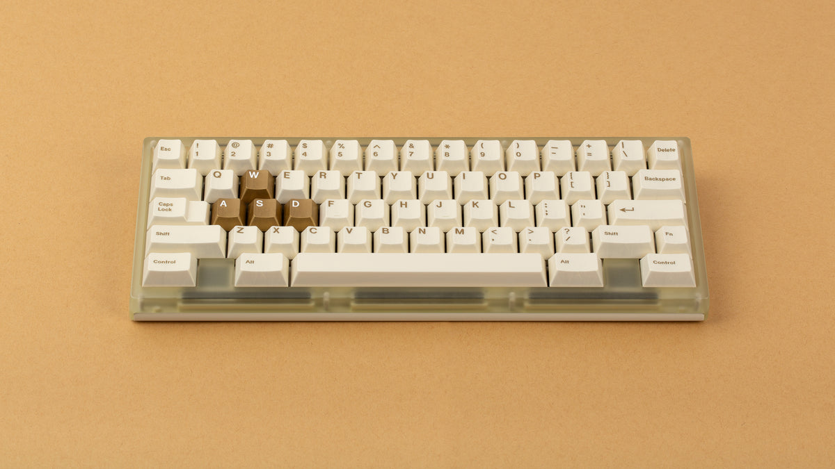  Beetle 60 in beige with keycaps and a brown. background 