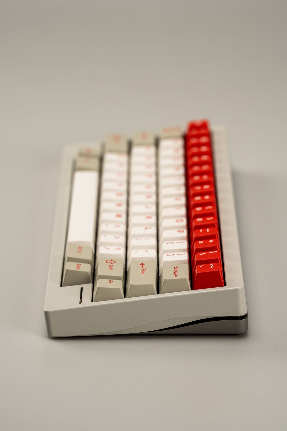  Keyboard with red escape key on a gray background 