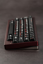 Load image into Gallery viewer, Black keyboard with red accents on a dark surface