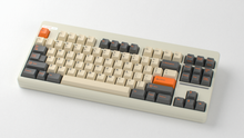 Load image into Gallery viewer, render of GMK CYL Carbon R3 on a beige Classic TKL keyboard angled