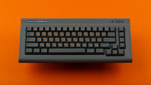 Load image into Gallery viewer, Command 65 Steel on Orange Background