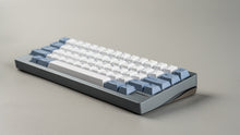 Load image into Gallery viewer, Mechanical keyboard with white and blue keys on a gray background