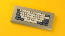 Load image into Gallery viewer, Render of DCS Mudbeam keycaps on a silver Piggy keyboard