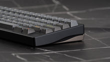 Load image into Gallery viewer, Close-up of a mechanical keyboard on a dark surface with geometric patterns