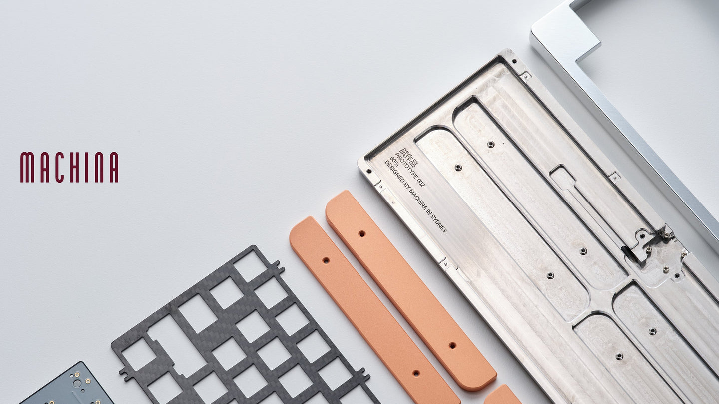 Keyboard components on a light gray background with 'MACHINA' branding.
