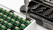 Load image into Gallery viewer, GEON x Nanch screwdriver being used to assemble a white mechanical keyboard
