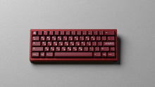 Load image into Gallery viewer, render of GMK CYL Blot R2 on a red keyboard