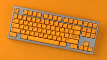 Load image into Gallery viewer, render of GMK CYL ADA on a silver keycult no 3 on an orange background