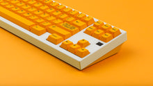 Load image into Gallery viewer, GMK CYL ADA keycaps close-up of navigation and arrow cluster on white keyboard, orange background