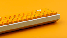 Load image into Gallery viewer, GMK CYL ADA keycaps on white TKL keyboard, rear side profile on orange background